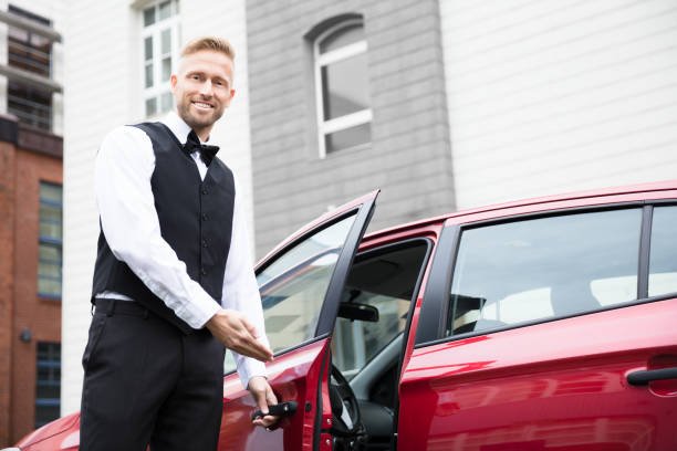 A professional valet driver warmly welcomes you with Super Drive, offering premium and reliable car services.